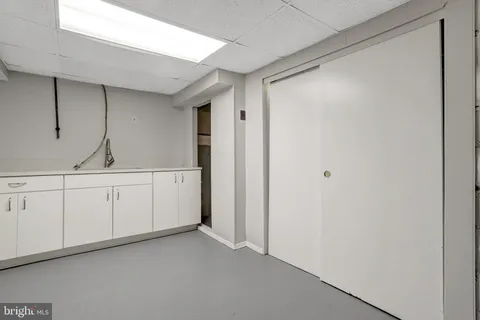 an aerial view of a city with lots of residential buildings and lake view