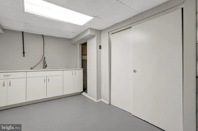 an aerial view of a city with lots of residential buildings and lake view