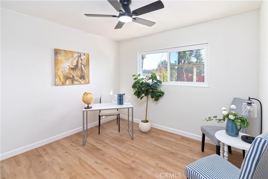 3306 Debbie Lane Riverside, CA 92501 - Photo 19 of 32 a workspace with furniture window and wooden floor