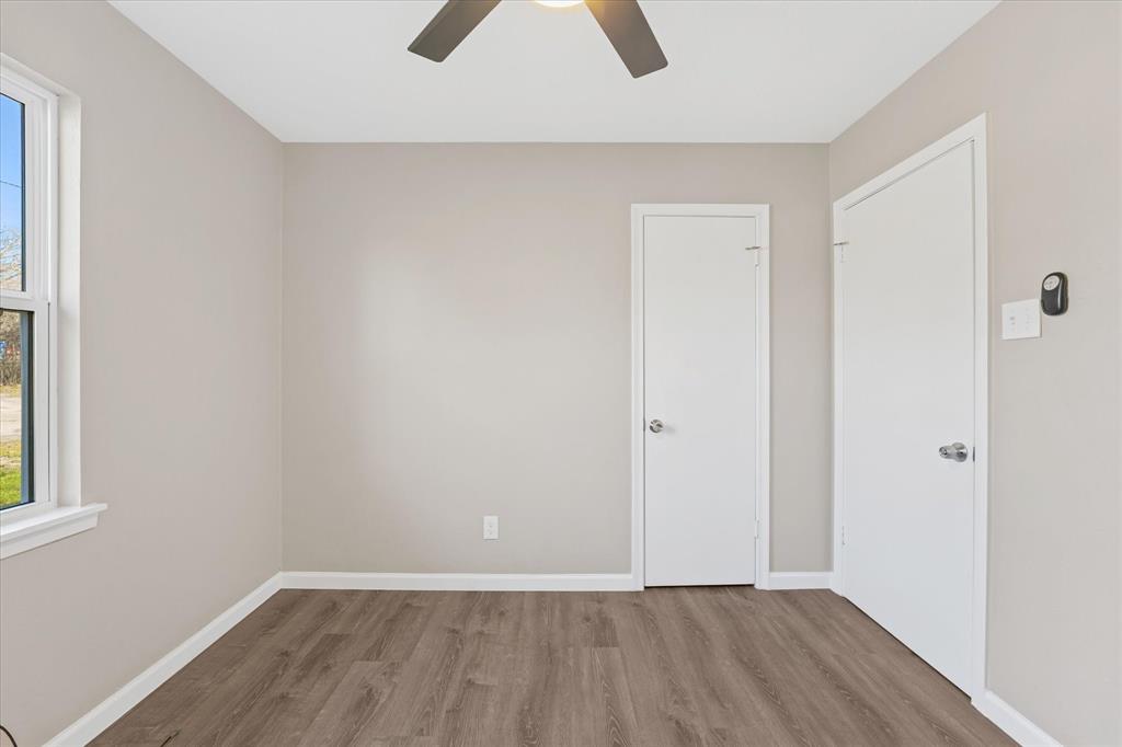 9521 Dalrock Road Rowlett, TX 75089 - Photo 14 of 38 an empty room with closet and chandelier fan