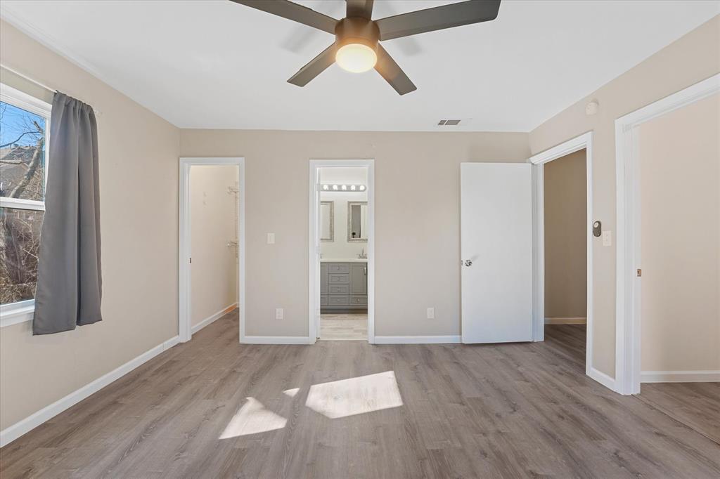 9521 Dalrock Road Rowlett, TX 75089 - Photo 20 of 38 wooden floor in an empty room with a window