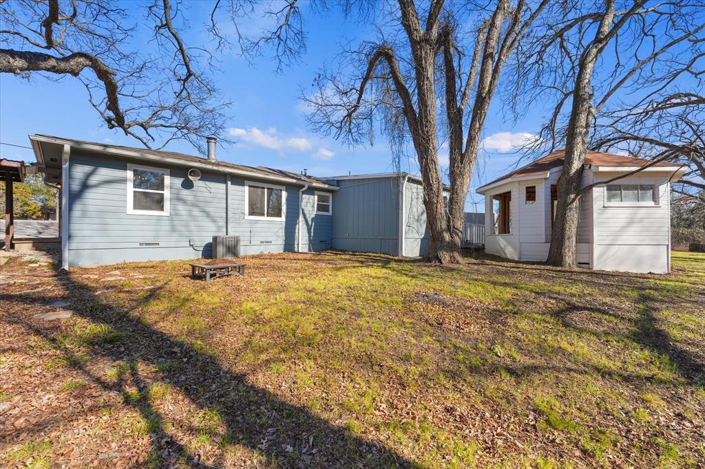 9521 Dalrock Road Rowlett, TX 75089 - Photo 27 of 38 a front view of house with yard and trees around