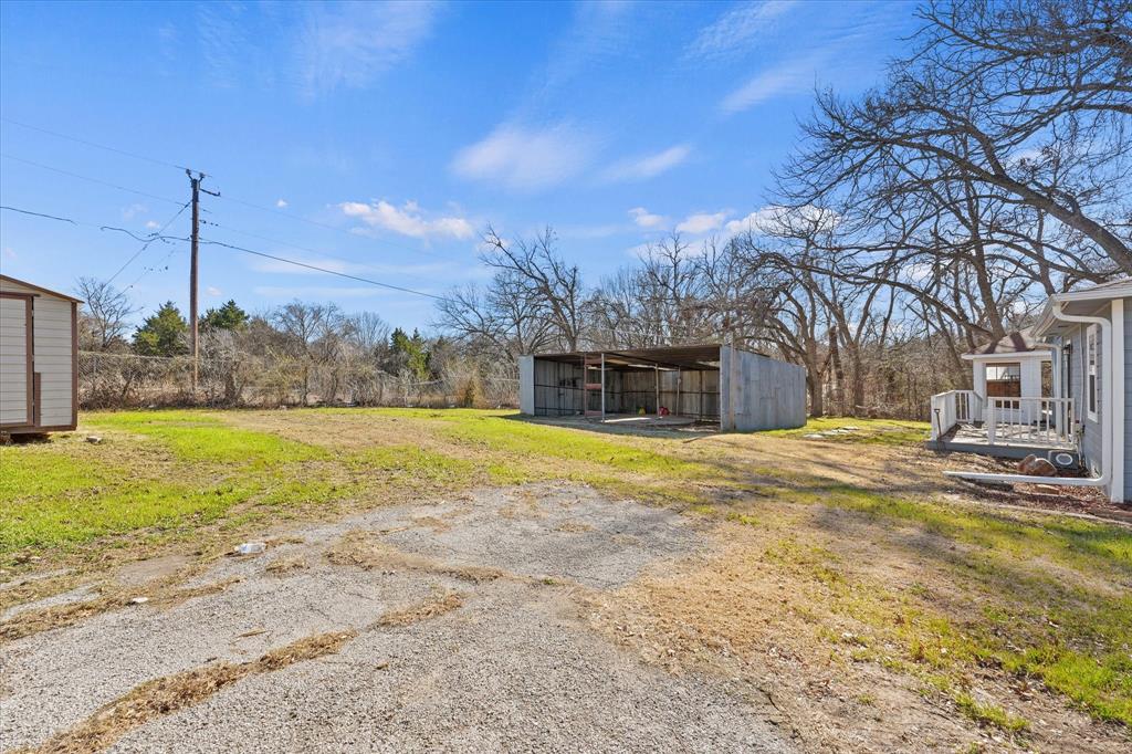 9521 Dalrock Road Rowlett, TX 75089 - Photo 32 of 38 a view of a swimming pool with an outdoor space and seating area