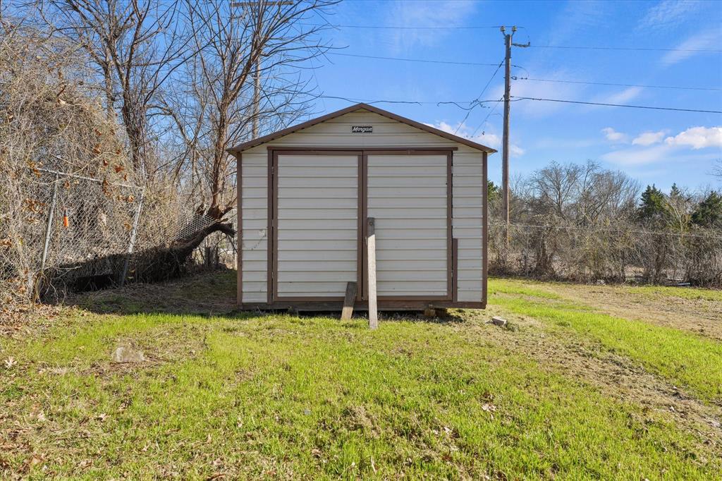 9521 Dalrock Road Rowlett, TX 75089 - Photo 33 of 38 a front view of house with yard and garage