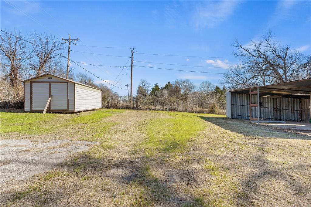 9521 Dalrock Road Rowlett, TX 75089 - Photo 34 of 38 a view of a house with a yard