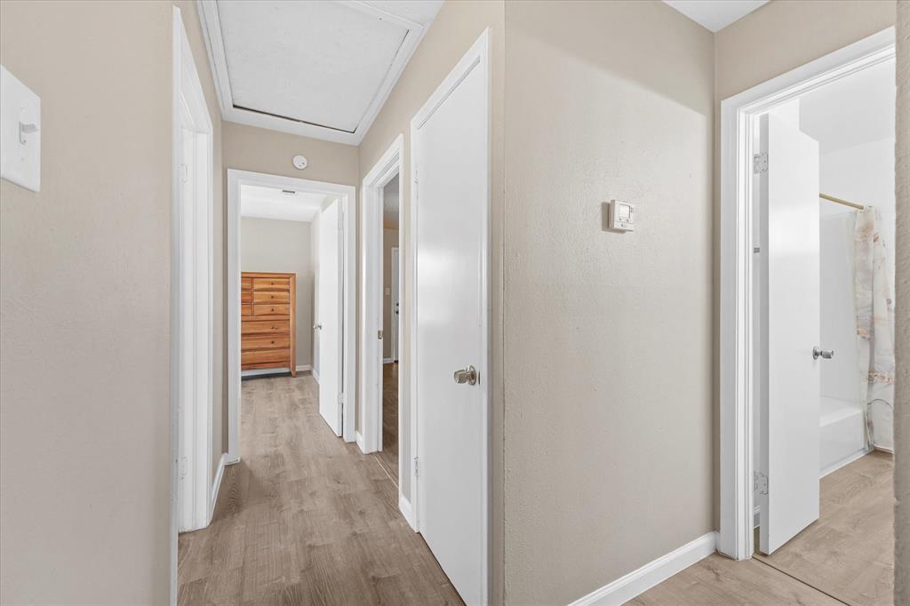 9521 Dalrock Road Rowlett, TX 75089 - Photo 10 of 38 a view of a hallway with a room