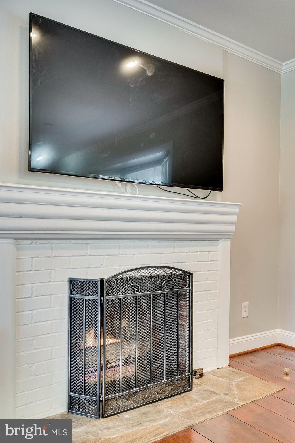 3076 Holmes Run Road Falls Church, VA 22042 - Photo 4 of 36 Cozy fireplace in the living room.