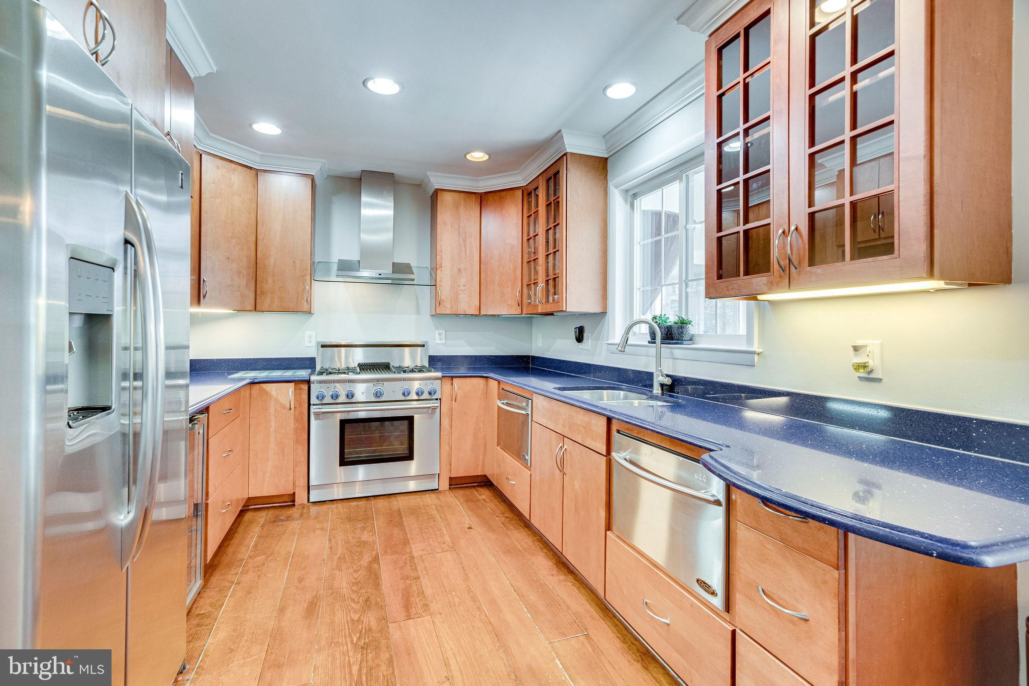 3076 Holmes Run Road Falls Church, VA 22042 - Photo 6 of 36 Striking countertops and SS appliances.