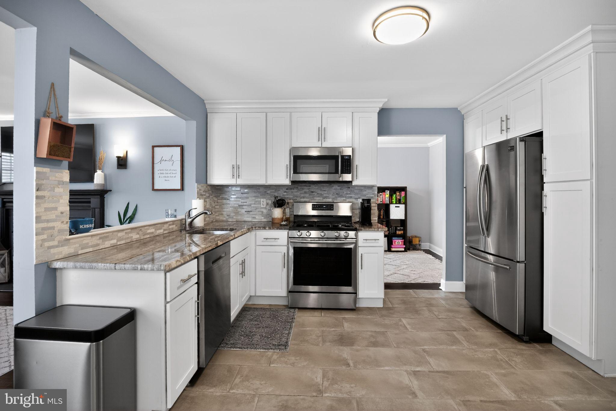 9 Bromley Court Atco, NJ 08004 - Photo 13 of 36 a kitchen with a sink stove and refrigerator