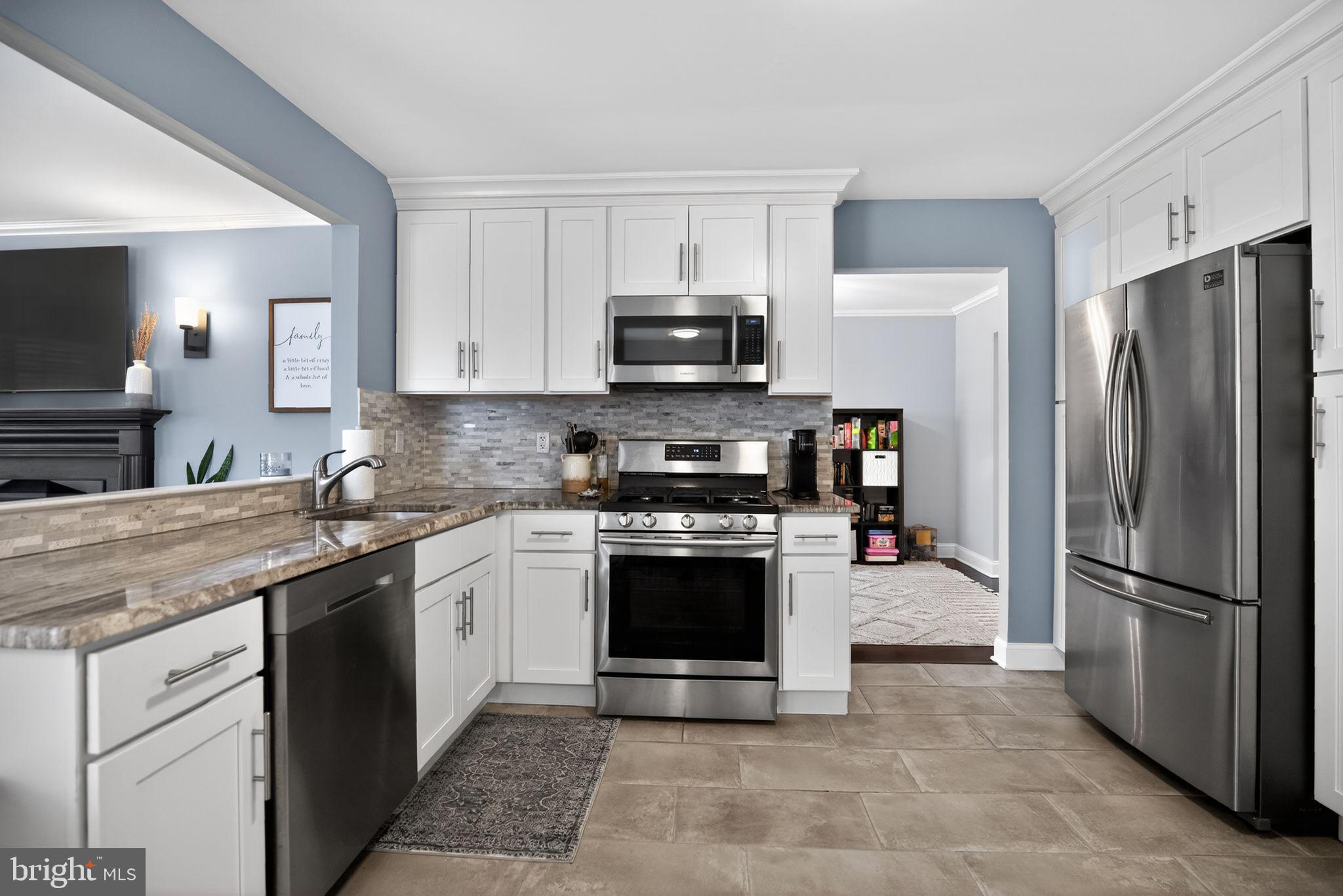 9 Bromley Court Atco, NJ 08004 - Photo 14 of 36 a kitchen with stainless steel appliances granite countertop a stove a refrigerator and a sink
