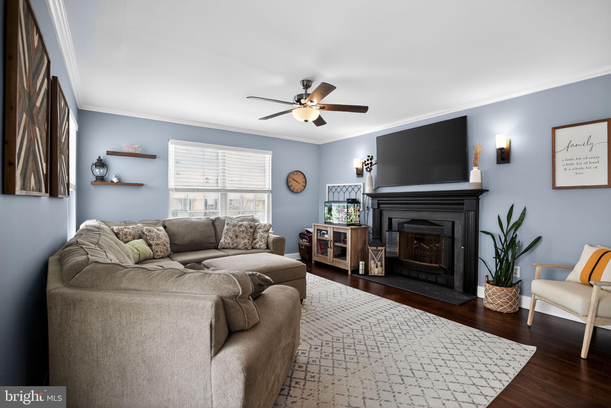 9 Bromley Court Atco, NJ 08004 - Photo 19 of 36 a living room with furniture a flat screen tv and a fireplace