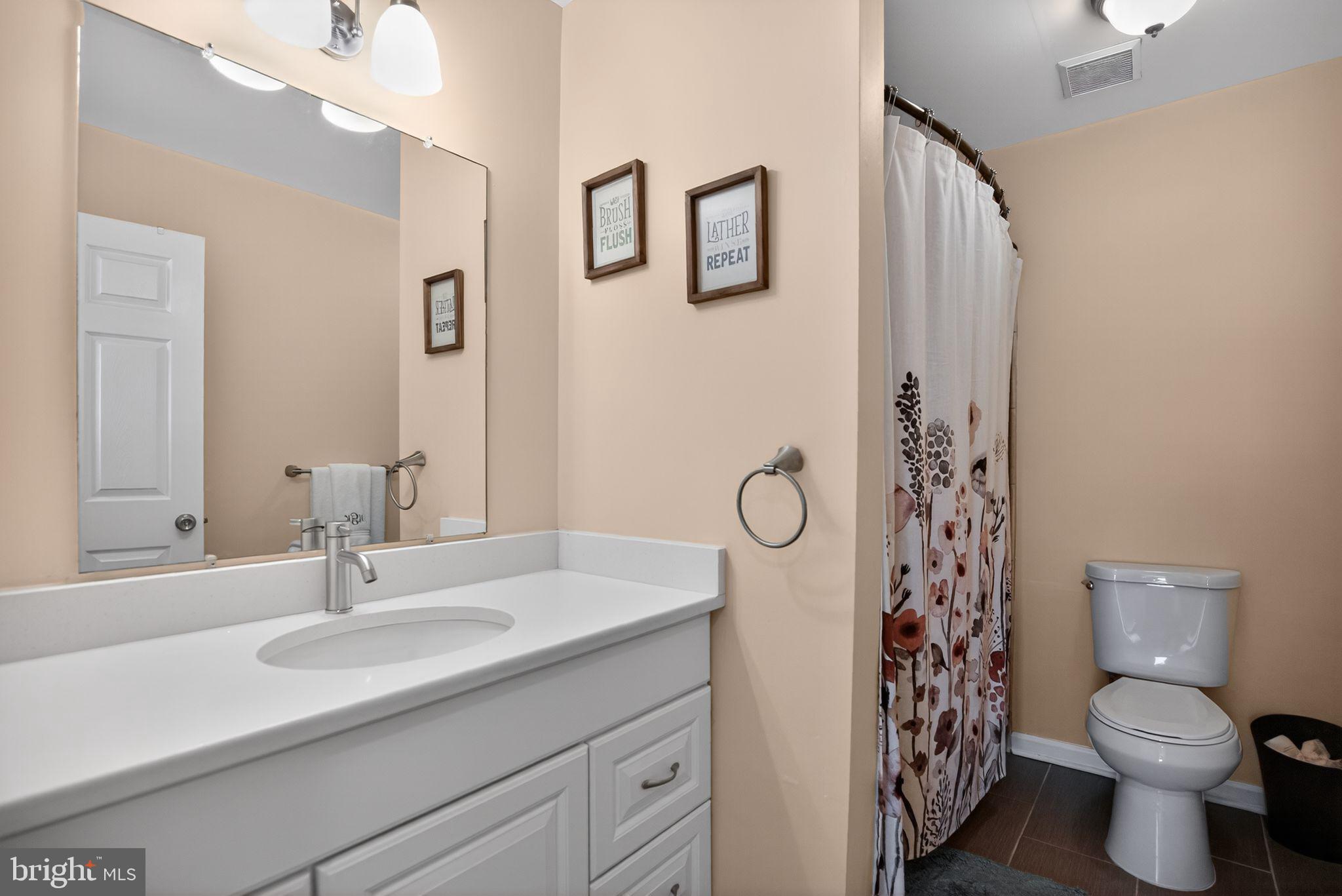 9 Bromley Court Atco, NJ 08004 - Photo 31 of 36 a bathroom with a sink toilet and shower