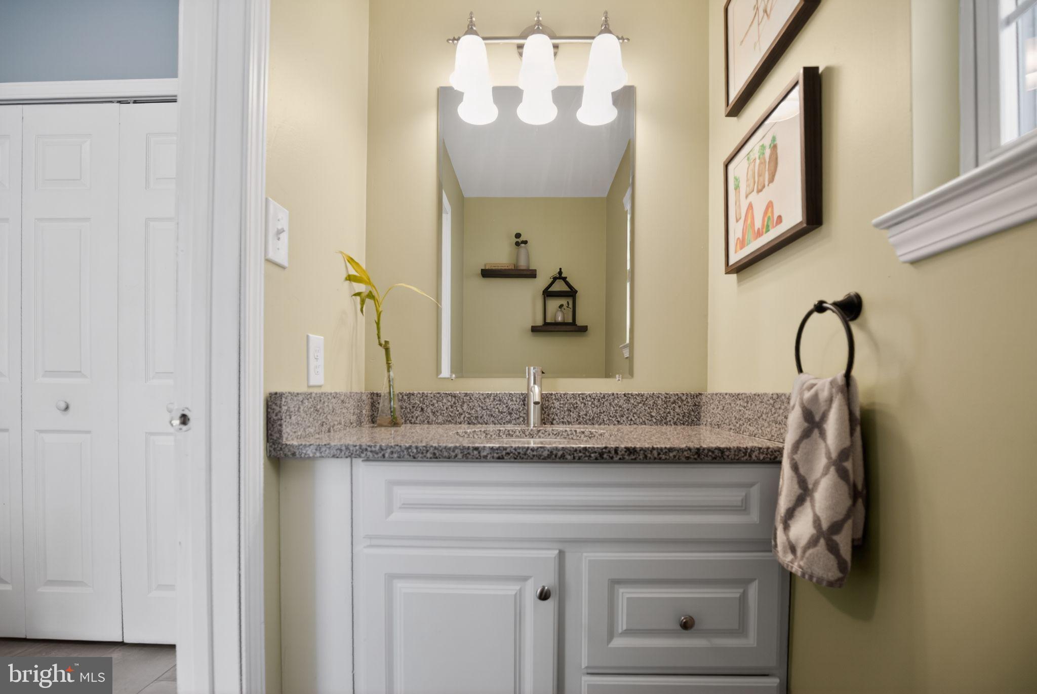 9 Bromley Court Atco, NJ 08004 - Photo 32 of 36 a bathroom with a granite countertop sink and a mirror