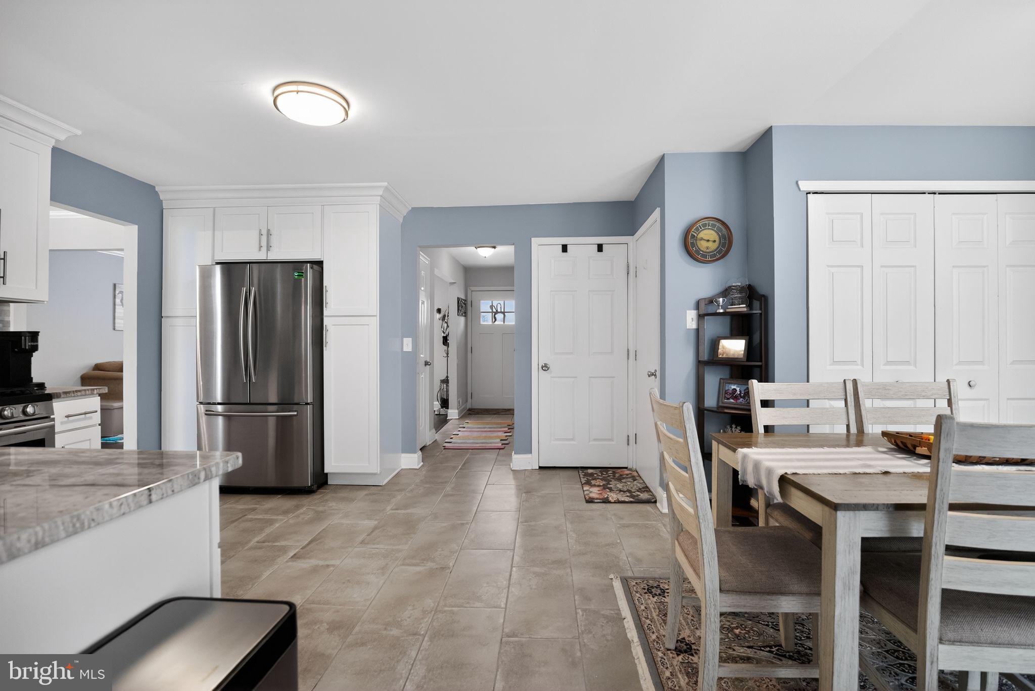 9 Bromley Court Atco, NJ 08004 - Photo 7 of 36 a kitchen with a refrigerator and a stove