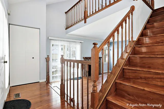 a view of an entryway with wooden floor