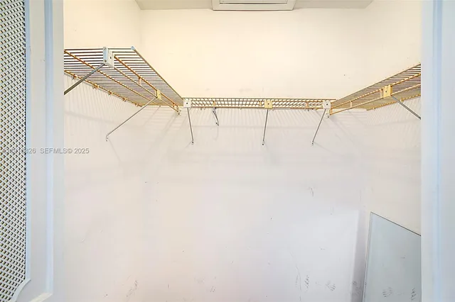 a bathroom with a sink a toilet and shower curtain