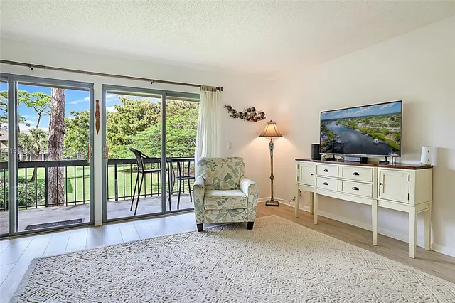 a living room with furniture and flat screen tv