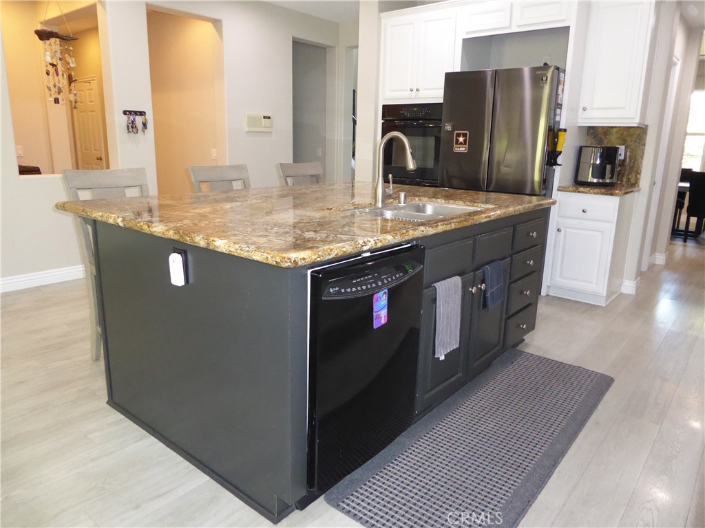17115 Noble View Circle Riverside, CA 92503 - Photo 5 of 50 Side of Kitchen Island showing Sink & Dishwasher. All new flooring which leads to the Formal Dining Room.
