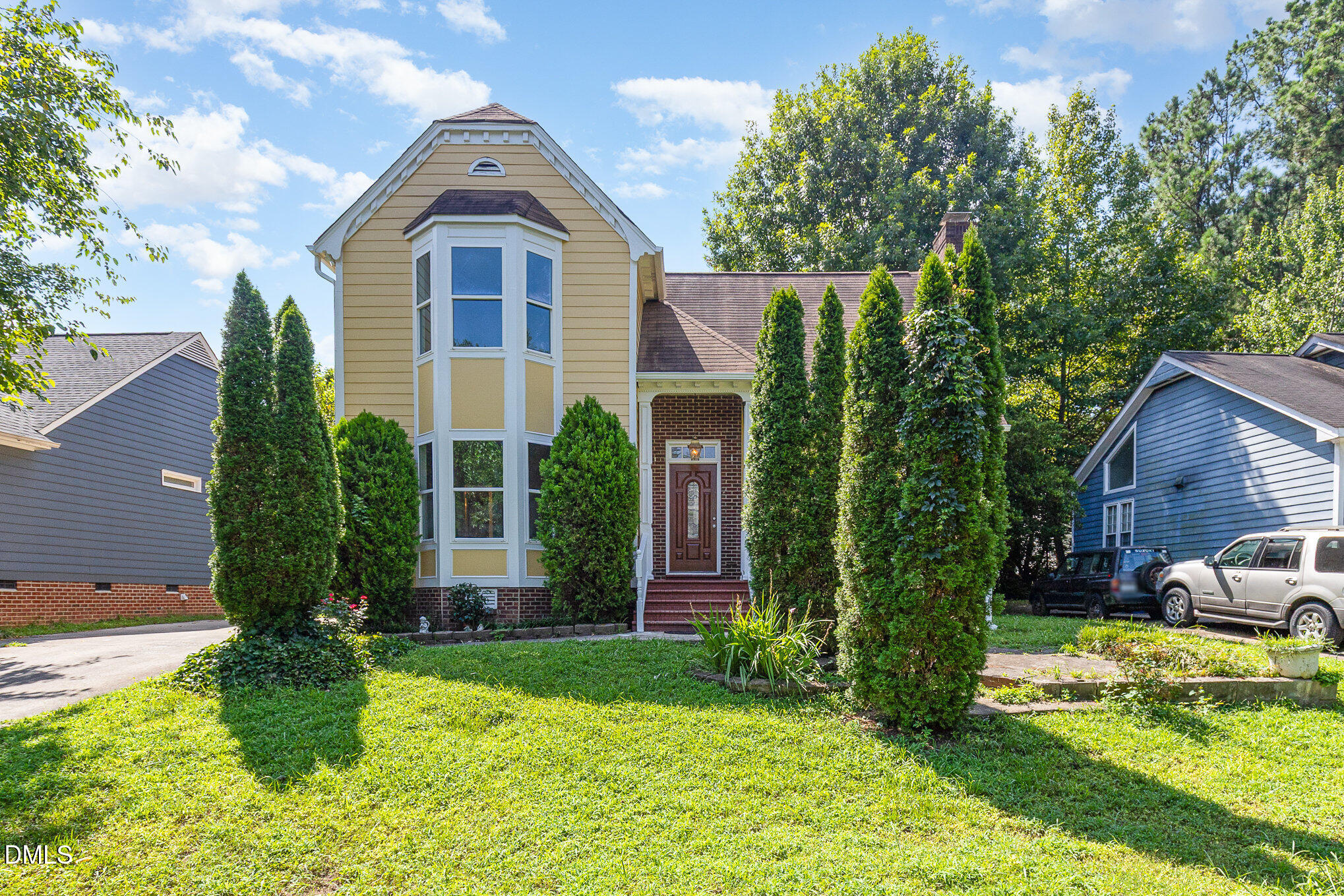 a front view of a house with garden
