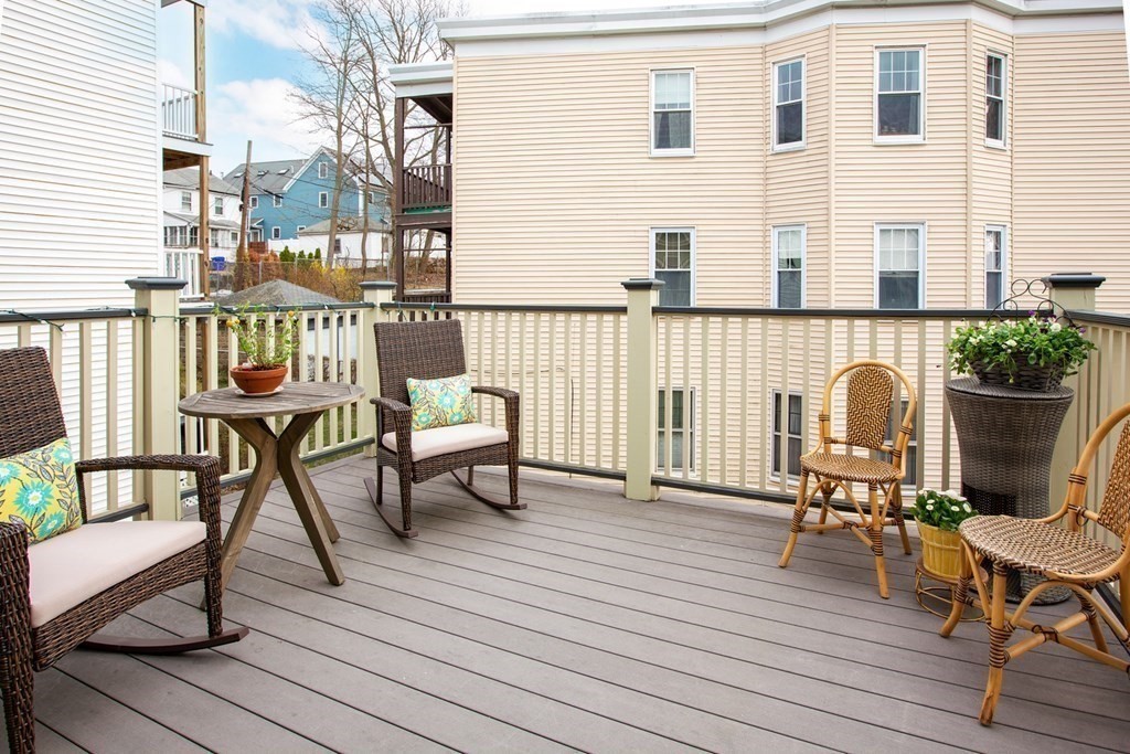 14 Castleton Street, Unit 2 Boston, MA 02130 - Photo 16 of 23 a table and chairs in front of a house