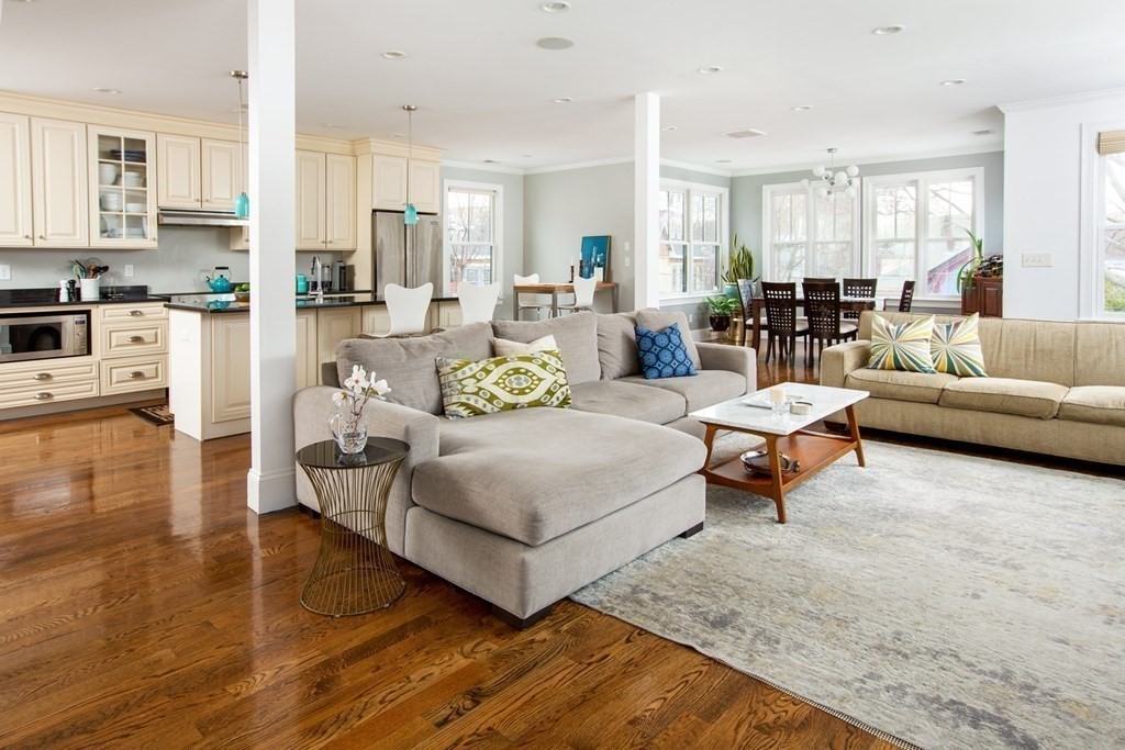 14 Castleton Street, Unit 2 Boston, MA 02130 - Photo 3 of 23 a living room with furniture and a dining table with kitchen view