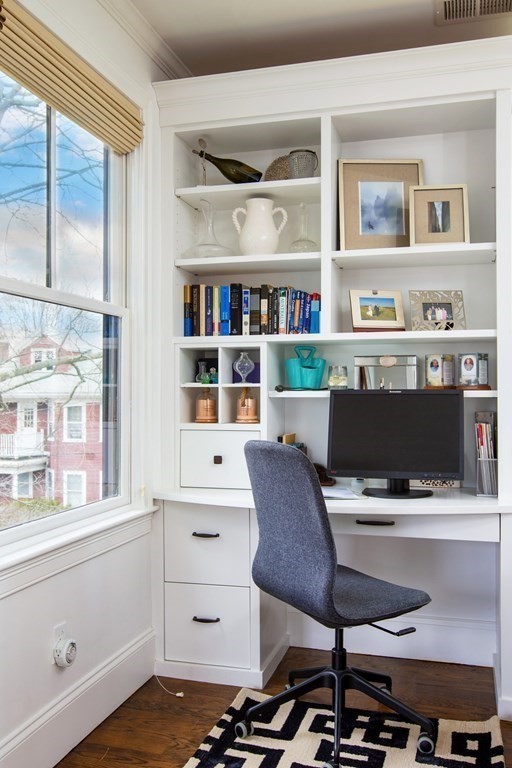 14 Castleton Street, Unit 2 Boston, MA 02130 - Photo 7 of 23 a room with furniture and a bookshelf