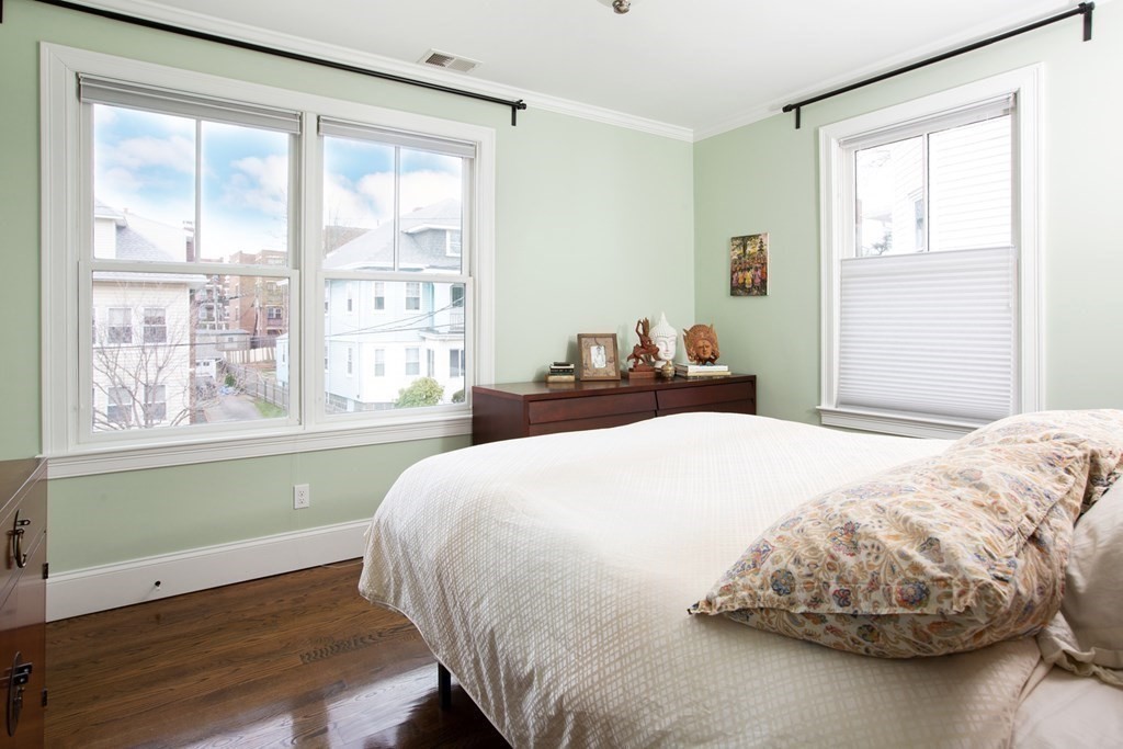 14 Castleton Street, Unit 2 Boston, MA 02130 - Photo 10 of 23 a bedroom with a bed and a large window