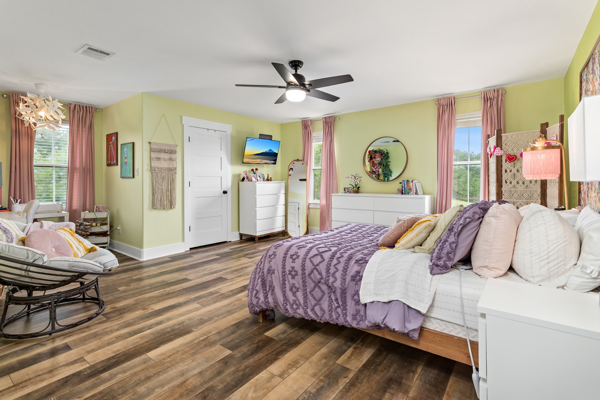 10573 Cooks Lake Road Lumberton, TX 77657 - Photo 32 of 47 a bedroom with a bed and a chandelier
