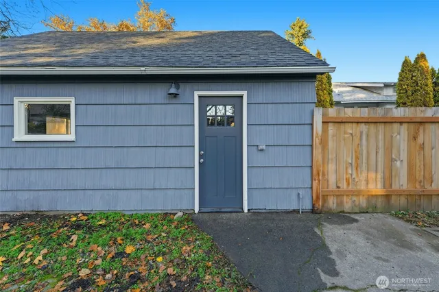 a aerial view of a house next to a yard