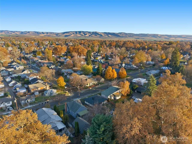 an aerial view of a house with a lake view