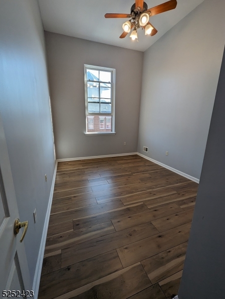 19 Market Street, Unit 405 Paterson, NJ 07501 - Photo 11 of 19 wooden floor in an empty room with a window