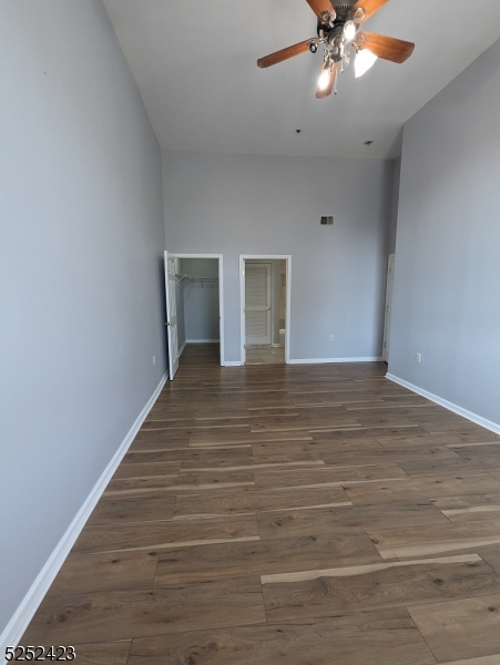 19 Market Street, Unit 405 Paterson, NJ 07501 - Photo 15 of 19 a view of an empty room with wooden floor