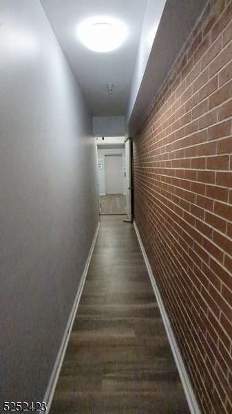 19 Market Street, Unit 405 Paterson, NJ 07501 - Photo 4 of 19 a view of a hallway with wooden floor