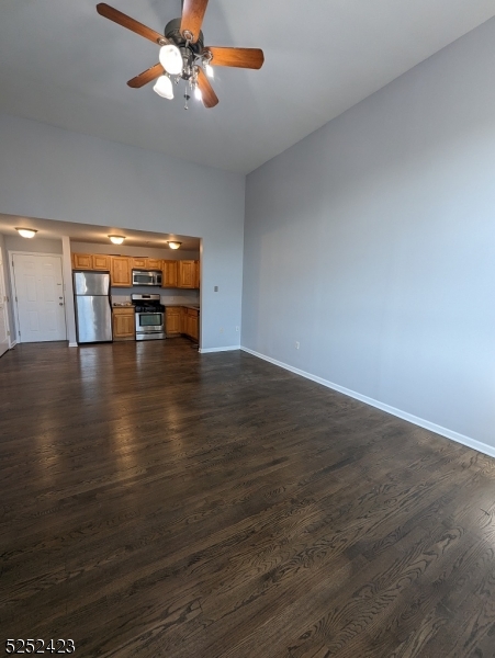 19 Market Street, Unit 405 Paterson, NJ 07501 - Photo 9 of 19 a view of empty room with wooden floor