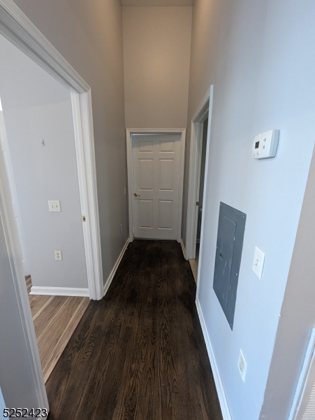 19 Market Street, Unit 405 Paterson, NJ 07501 - Photo 10 of 19 a view of a hallway view with wooden floor and staircase