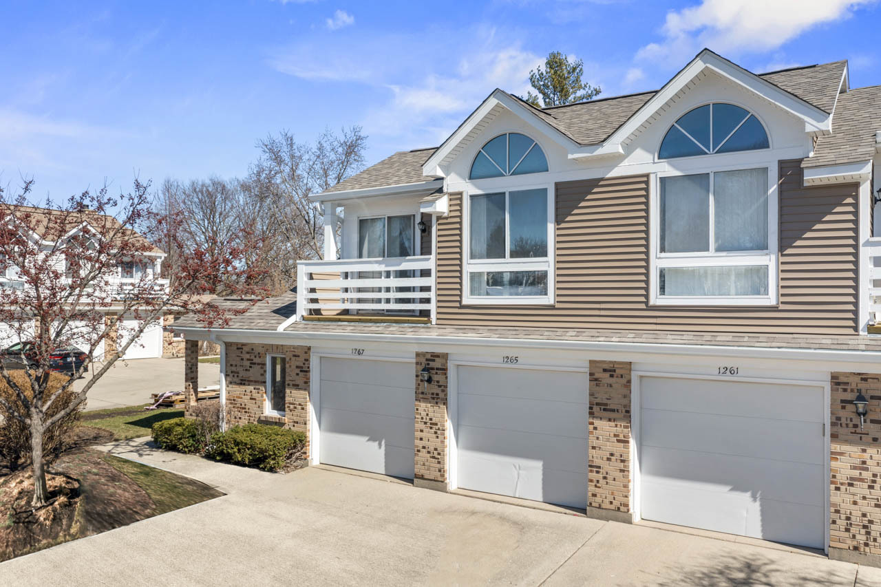 1265 Ranchview Court Buffalo Grove, IL 60089 - Photo 1 of 24 a front view of a house with a yard