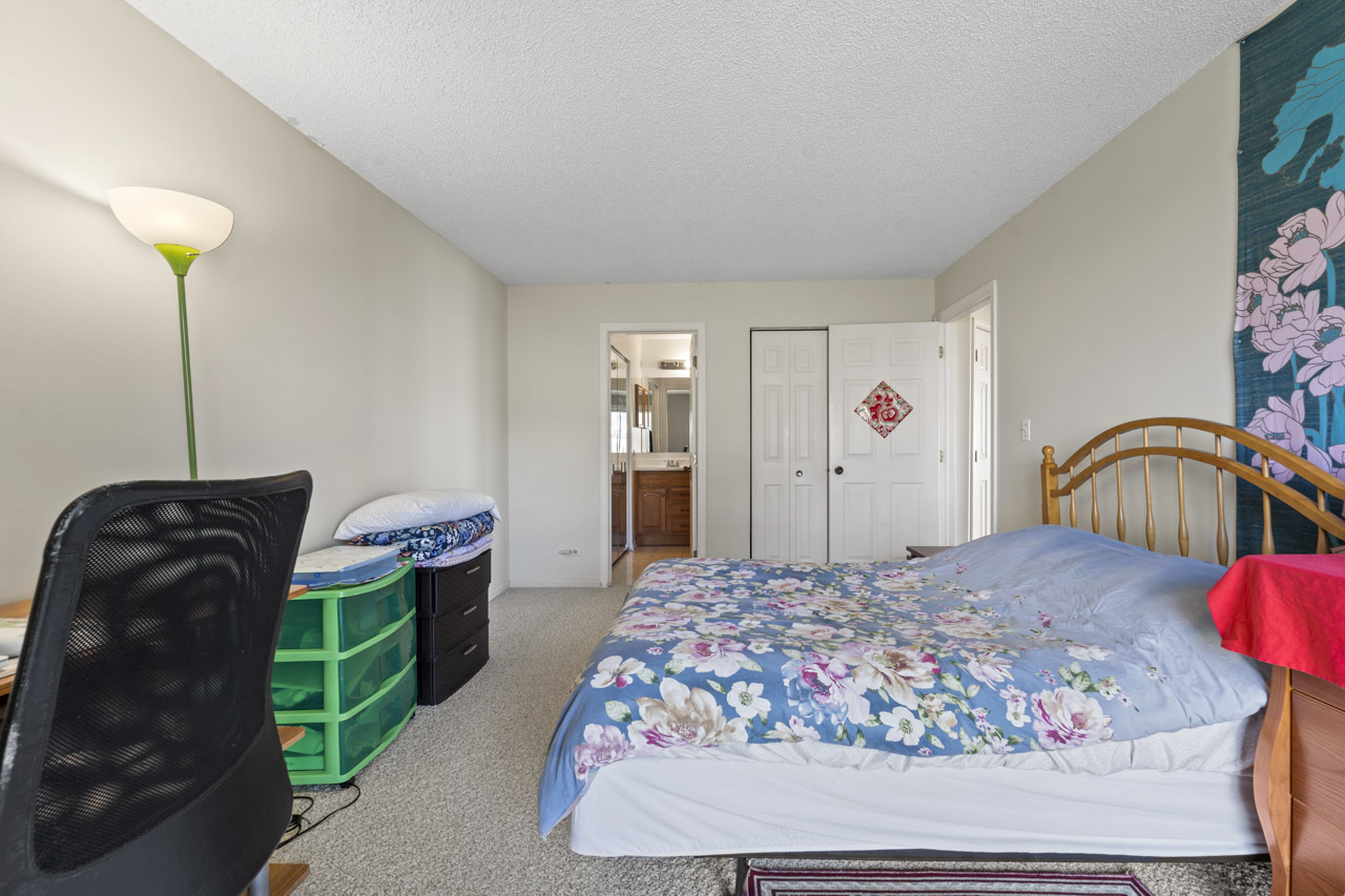 1265 Ranchview Court Buffalo Grove, IL 60089 - Photo 17 of 24 a bedroom with a bed window and dresser