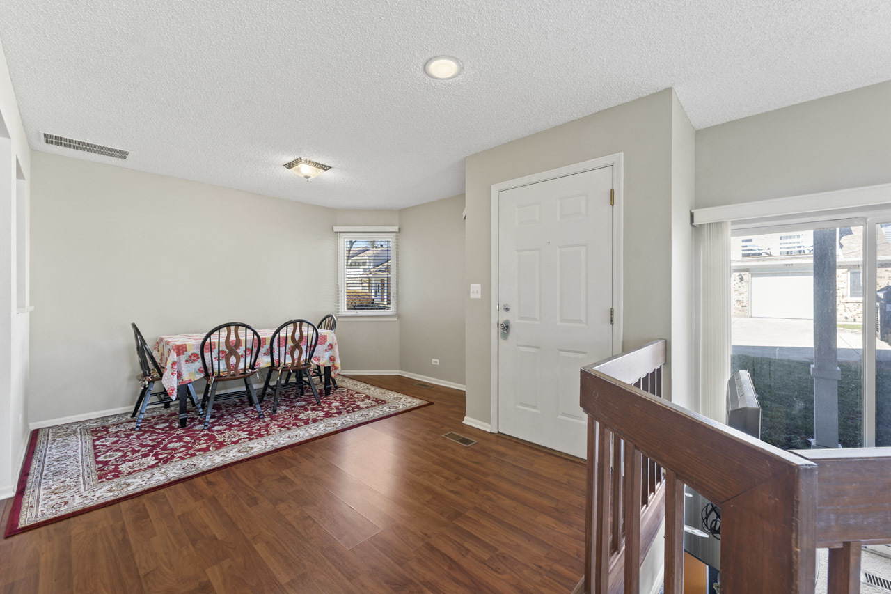 1265 Ranchview Court Buffalo Grove, IL 60089 - Photo 2 of 24 a living room with furniture and wooden floor