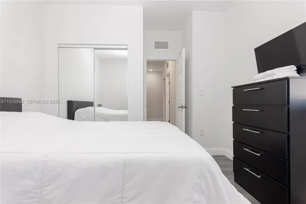 a bedroom with a bed and a table