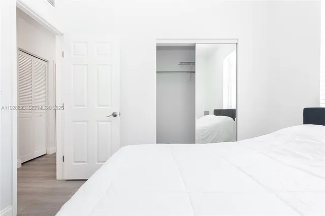 a bedroom with a bed and a table