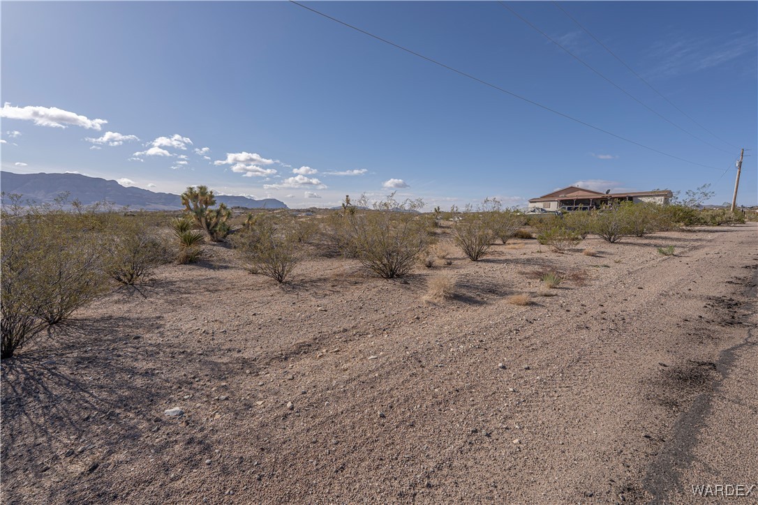 30430 Haystack Drive Meadview, AZ 86444 - Photo 5 of 20 a view of a dry yard with mountains in the background