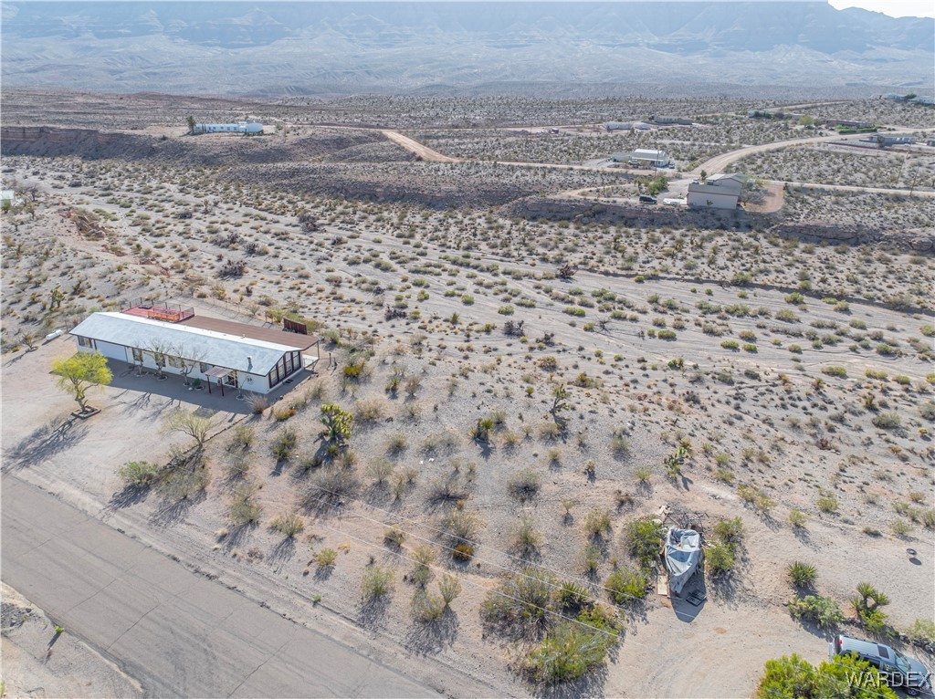 30430 Haystack Drive Meadview, AZ 86444 - Photo 8 of 20 a view of a dry yard with wooden fence