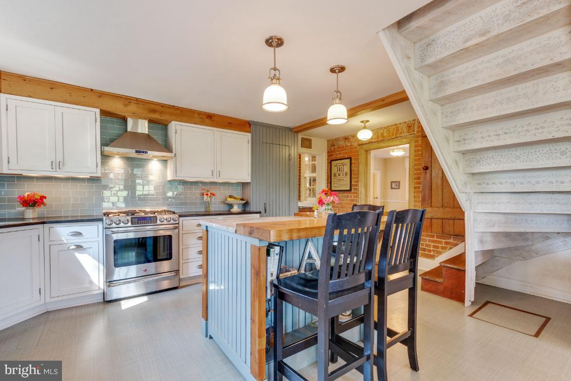 16191 Hamilton Station Road Waterford, VA 20197 - Photo 11 of 94 Kitchen island with wood and granite countertops