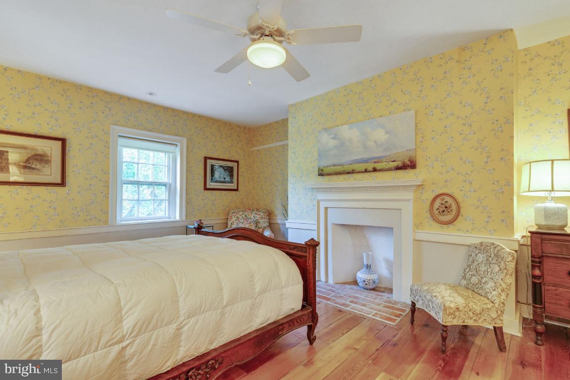 16191 Hamilton Station Road Waterford, VA 20197 - Photo 35 of 94 Primary bedroom with original fireplace