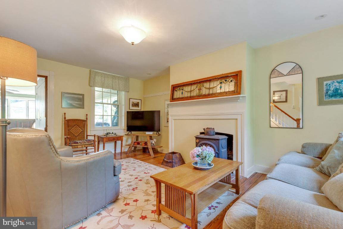 16191 Hamilton Station Road Waterford, VA 20197 - Photo 8 of 94 Family Room with wood stove and original hardwood
