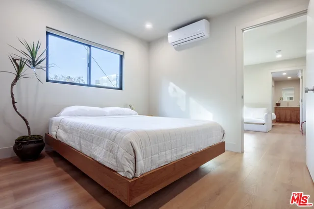 a bedroom with a bed and a view