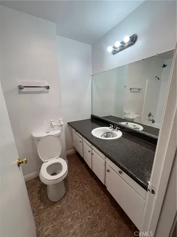 a view of room and hall with wooden floor