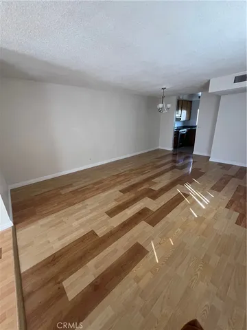 a kitchen with a stove sink and cabinets
