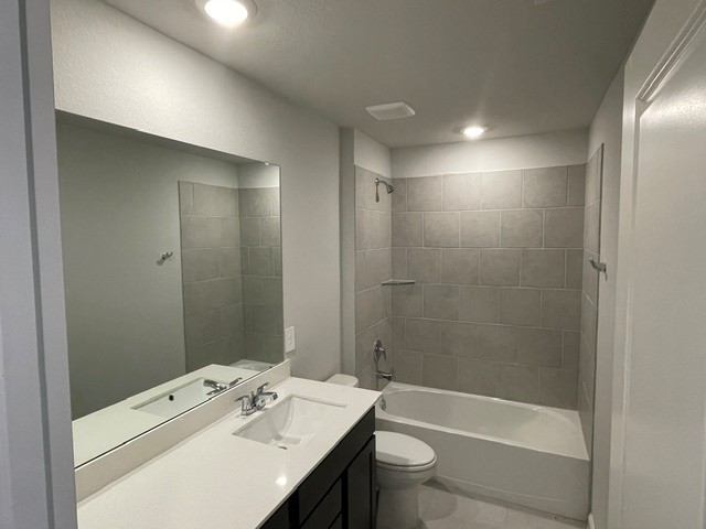 1024 Legrand Street Brenham, TX 77833 - Photo 6 of 7 a bathroom with a bathtub shower sink vanity and toilet