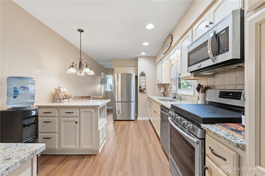 2945 Ashlar Drive Springfield, OH 45503 - Photo 7 of 20 This spacious kitchen offers ample countertop space, modern appliances, and convenient island seating.